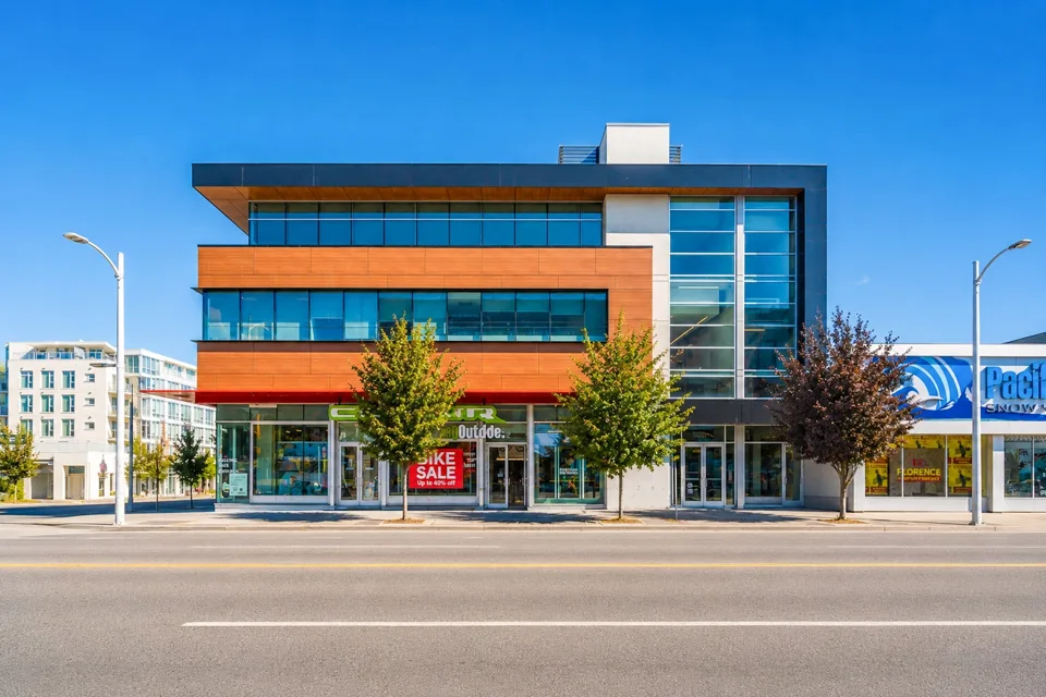 Contemporary commercial building with wood and glass frontage