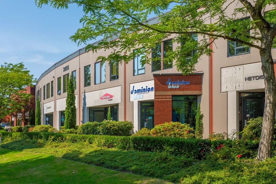 Landscaped industrial business frontage with brick entrances