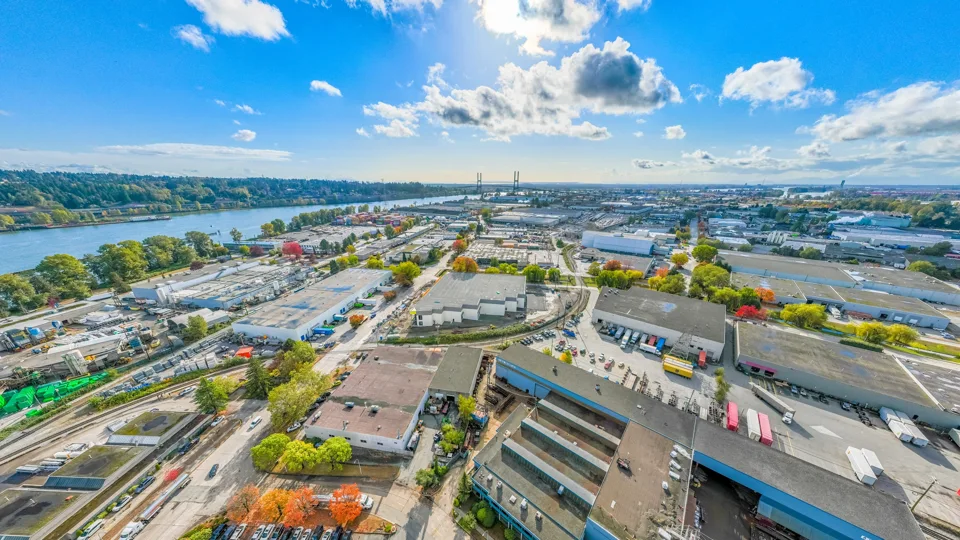 Industrial district beside the river with warehouses and rail access