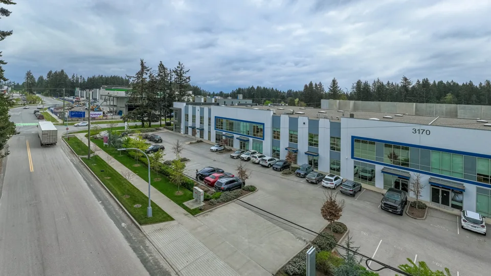Elevated view of a modern industrial building and access road