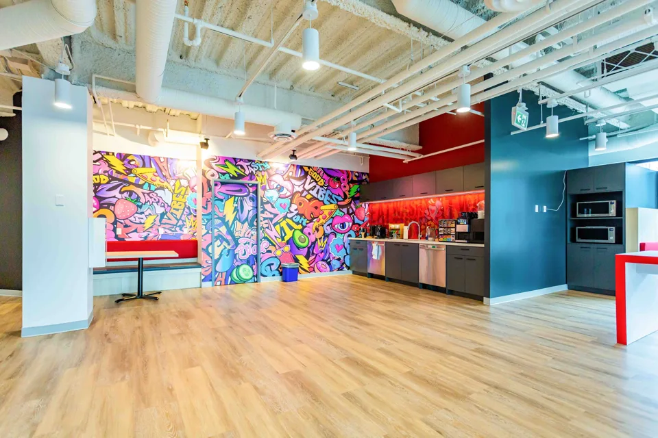 Colourful workplace kitchen and open gathering space
